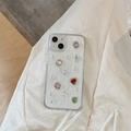 Detail of luxury iPhone case with colorful glitter gems and red heart crystal accents - iPhone 7/8/SE 2020 / Pearl Colored Gemstones