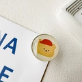 Detail of round crystal resin phone grip featuring a cute yellow bear with a red hat - Yellow Bear Head (Transparent Base)
