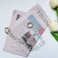 Close-up of iridescent acrylic bag chain strap with golden ring clasps on vintage paper - Double Ring Laser Holographic Chain