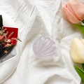 Detailed view of a translucent purple shell phone grip on a white fabric backdrop - Glitter Shell - Purple