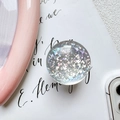 Detail shot of holographic glitter pattern inside a clear resin expandable phone socket - Laser Mosaic