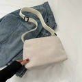 Minimalist beige corduroy crossbody bag with adjustable wide white strap and soft texture - Beige