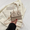 Retro cream crossbody bag with vintage brown floral pattern and golden hardware strap - Off White