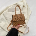 Mini vintage brown crossbody bag with geometric floral print and top handle - Brown