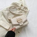 Elegant off-white leather square bag with gold metal buckle and top handle strap - White
