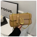 Detail of camel PU leather shoulder bag featuring a chunky gold D-ring and chain strap - Khaki