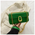 Close-up of grass green crossbody bag with gold chain and geometric twist lock - Green