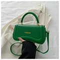 Detail of green leather square bag with fashion text, metal buckle and handle - Green