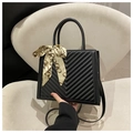 Chic black V-quilted handbag with elegant printed silk scarf and crossbody strap - Black