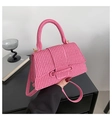 Detail of pink woven texture on trapezoid handbag with gold metallic buckle closure - Pink