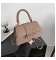 Detailed close-up of a coffee brown woven PU leather handbag with gold metal hardware - Tan