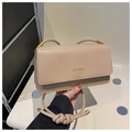 Detail of beige minimalist square bag featuring knotted rope strap and MISSMINI logo - Khaki