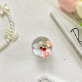 Dettaglio del supporto per telefono con ciliegia, margherite e glitter colorati - Margherita Ciliegia - Laser Argento
