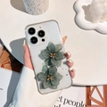 Close-up of clear iPhone case with 3D green flowers and silver foil glitter details - iPhone 7/8/SE 2020 / Silver Foil 2 Lotus Flowers Green