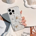 Detail of transparent iPhone case with 3D white resin flowers and silver foil flakes - iPhone 7/8/SE 2020 / Silver Foil 2 Lotus Flowers White