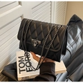 Chic black quilted shoulder bag with dual chain straps and vintage metal buckle detail - Black