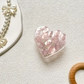 Detailansicht herzförmiger Handyhalter mit rosa Knöpfen auf weißem Hintergrund - Transparenter Tropfkleber Rosa Knopf Stil
