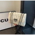 Detailed view of white quilted faux leather texture and metal chain clasp on handbag - Off White