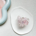 Macro detail of heart-shaped resin phone grip with 3D rose, butterfly and pearls - Transparent Resin Butterfly Flower / Pink