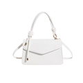 Ivory white corduroy crossbody bag with woven texture and knotted top handle detail - White