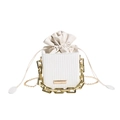 White woven bucket bag with cream leather drawstring and chunky gold chain handle - White