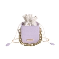 Chic lavender woven bucket bag featuring thick gold chain decor and a drawstring closure - Purple