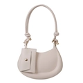 Minimalist beige crescent shoulder bag with thick rope strap and mini hanging pouch charm - White