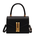 Classic black leather crossbody bag with gold vertical metal lock and top handle - Black