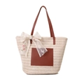 Cremefarbene Stroh-Tote-Bag mit braunen Ledergriffen und floraler Spitzenschleife - Cremeweiß