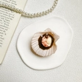 Macro shot of realistic resin scallop with shrimp topping mobile phone socket grip - 3D Brown Scallop