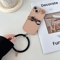 Detail of soft pink silicone phone case featuring 3D bear, donut charms and black wrist strap - iPhone 7/8/SE 2020 / Honey Bear (Khaki)