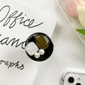 Detail of round phone grip with faux tiger eye stone, pearl and mother of pearl inlay - Brown Cat Eye