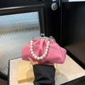 Pink cloud handbag with pearl bead handle and silver chain strap shown in hand - Rose Red