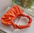 Chic orange pleated dumpling bag with a ruched top handle for a stylish feminine look - Orange