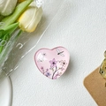 Detail view of a pink heart-shaped phone grip featuring floral and dragonfly art patterns - White Base Stand / Crystal Glass Style Pink Dragonfly Flower