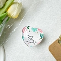 Macro shot of heart-shaped glass phone stand with flower pattern and enjoy Every moment text - White Base Stand / Crystal Glass Style Apricot Lotus