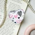 Close-up of heart-shaped phone grip stickers with floral and leopard print patterns - White Base / Hand-drawn Heart