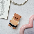 Primer plano detallado de un soporte de móvil de oso acrílico sobre fondo blanco puro - Transparente-Oso Camiseta Amarilla Bolsillo