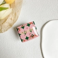 Detail view of square liquid sand phone grip with floral patterns and colorful beads - Pink Green Floral (Geometric)