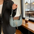 Chic crescent shoulder bag in dusty blue matte leather with gold letter logo and tassel - Green