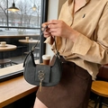 Deep grey crescent bag in suede texture with gold SS logo and tassel detail - Black