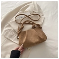 Macro shot of brown suede pleated handbag with knotted handle and shoulder strap detail - Brown
