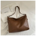 Close-up of brown faux leather shoulder bag with lychee texture on white corduroy - No Pendant / Brown