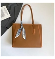 Detail of brown litchi pattern leather tote bag with a decorative French print silk scarf - Brown