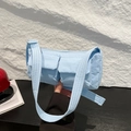 Quilted light blue crossbody bag with double front pockets and adjustable strap - Blue
