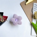 Purple plush flower phone grip stand with soft texture on a white decorative setting - Purple Plush Flower