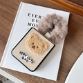 Detail of plush bear embroidery and textured beige cover for Samsung Z Flip phone case - Fine Leather Gold (With Plush Bear & Hand Ring) / Samsung ZFlip3