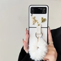 Detail of luxury Samsung Z Flip case with plush pompom and gold bear embellishment - Cross Grain White (With Plush Hand Chain) / Samsung ZFlip3