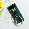 Detail of dark green leather phone case with pearl bracelet and golden bow for Z Flip 6 - Huawei Pocket 2 / Dark Green