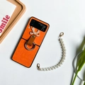 Detail of orange leather Galaxy Z Flip6 case with diamond bow, ring and pearl handle - Samsung ZFlip3 / Orange